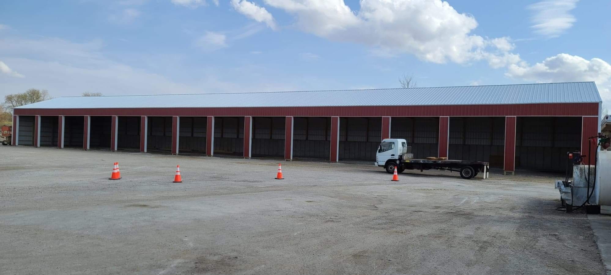 Long red metal storage building completed by JRH