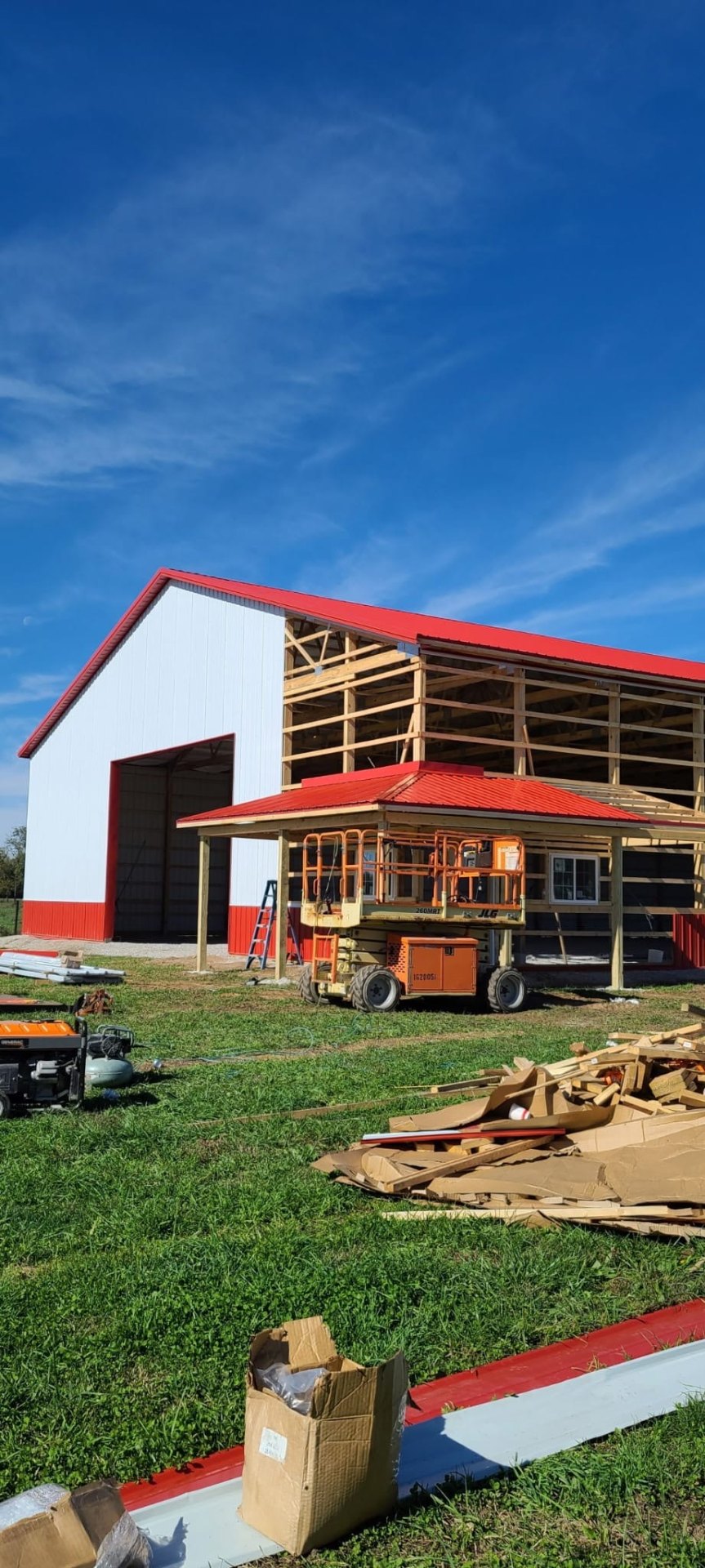 Pole barn workshop with red metal roof